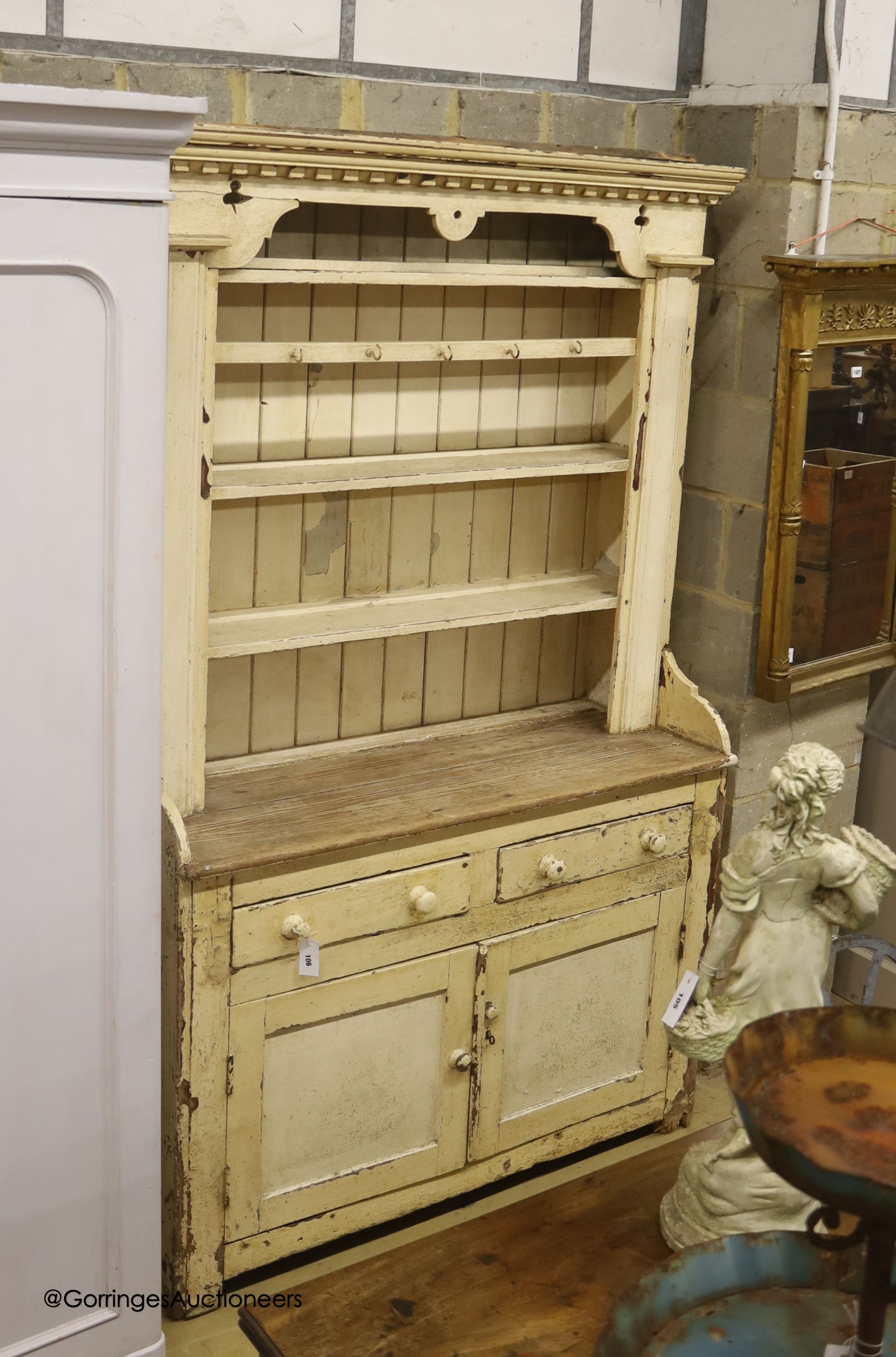 An early 19th century Irish painted pine dresser, width 126cm depth 49cm height 209cm